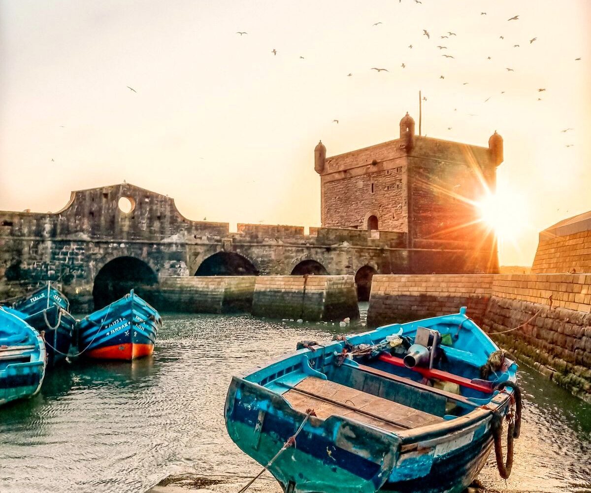 Essaouira port, blue fishing boats and Skala ramparts, Morocco