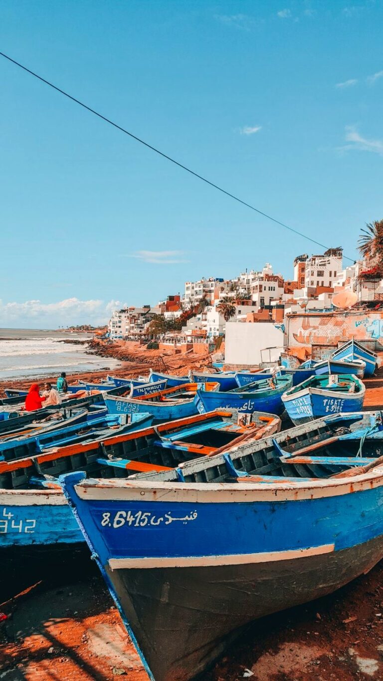 Essaouira port, blue fishing boats and Skala ramparts, Morocco