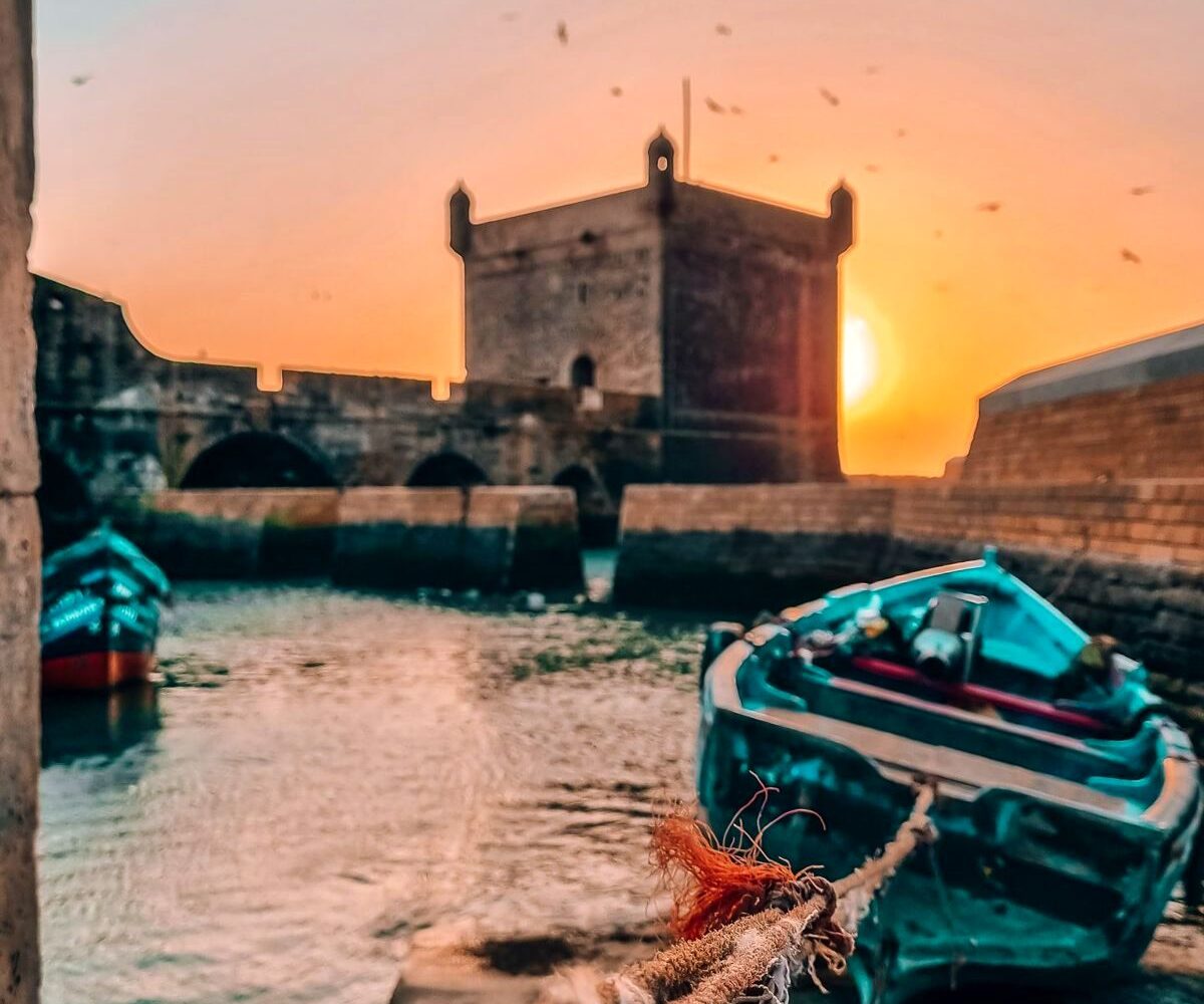 Essaouira port, blue fishing boats and Skala ramparts, Morocco