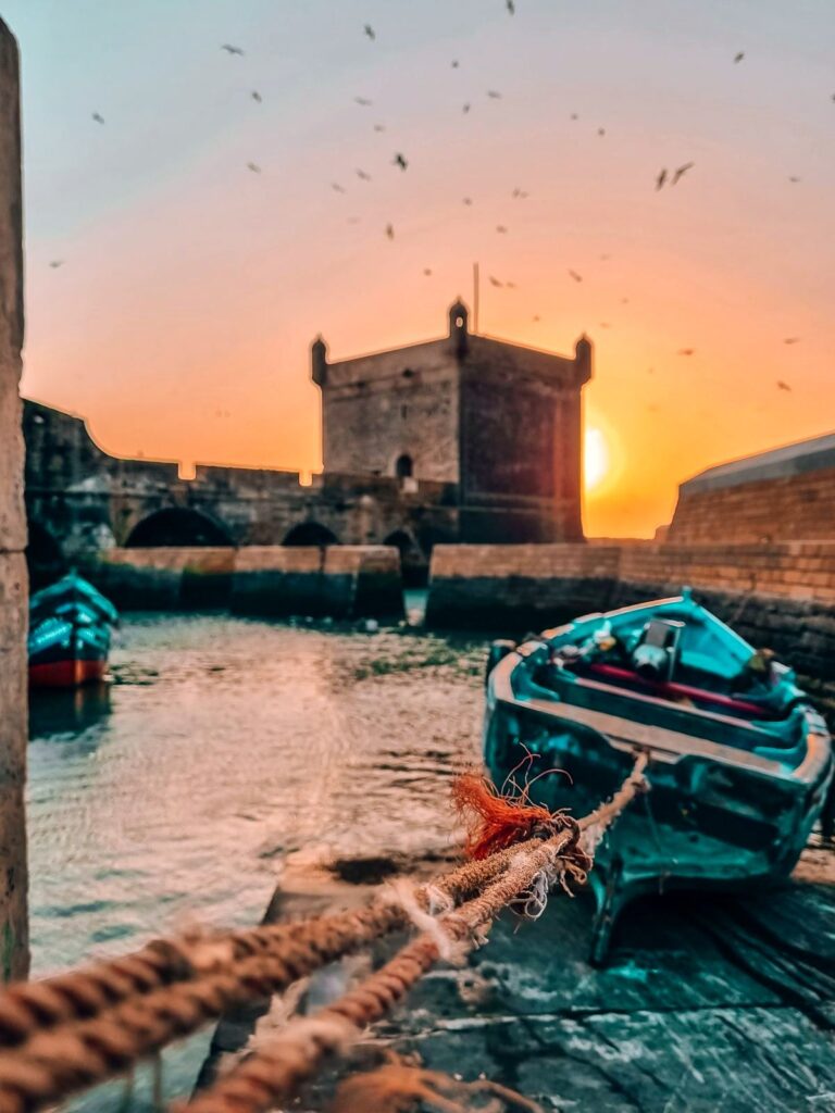 Essaouira port, blue fishing boats and Skala ramparts, Morocco
