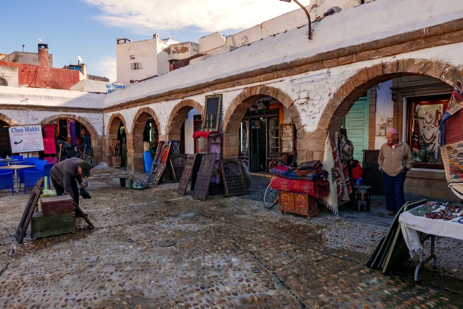Essaouira port, blue fishing boats and Skala ramparts, Morocco