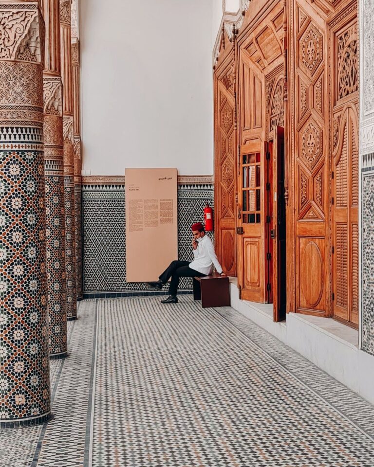 Carved cedar and zellige in a historic madrasa, Fes