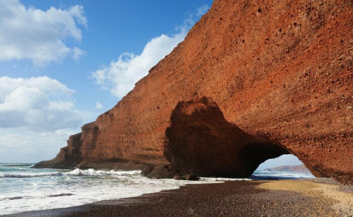 Red sandstone arch on Legzira beach, Morocco