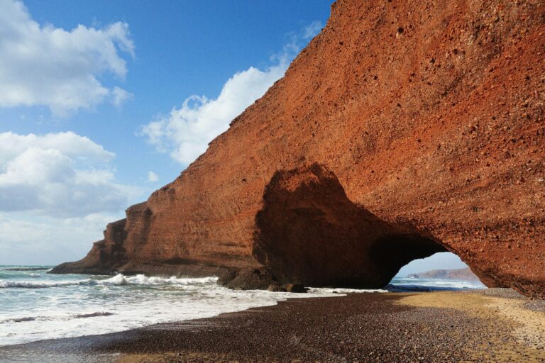 Red sandstone arch on Legzira beach, Morocco