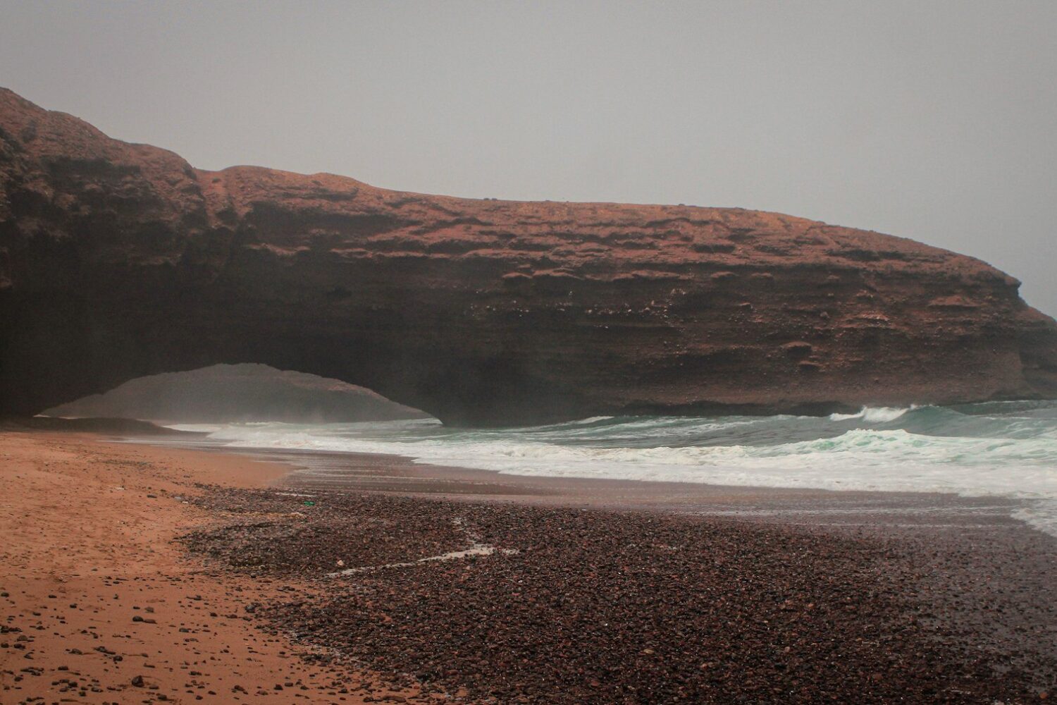 Legzira beach and red cliffs, Morocco