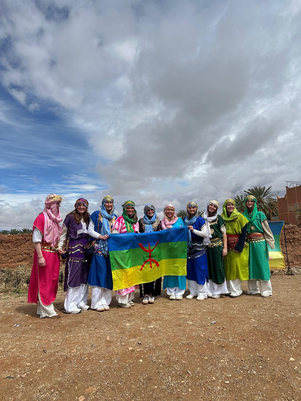 Students holding the Amazigh flag on a Morocco Cultours trip