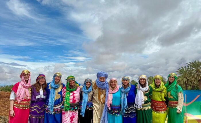 Student group in traditional Amazigh dress with their Morocco Cultours guide