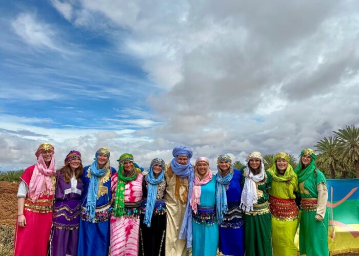 Student group in traditional Amazigh dress with their Morocco Cultours guide