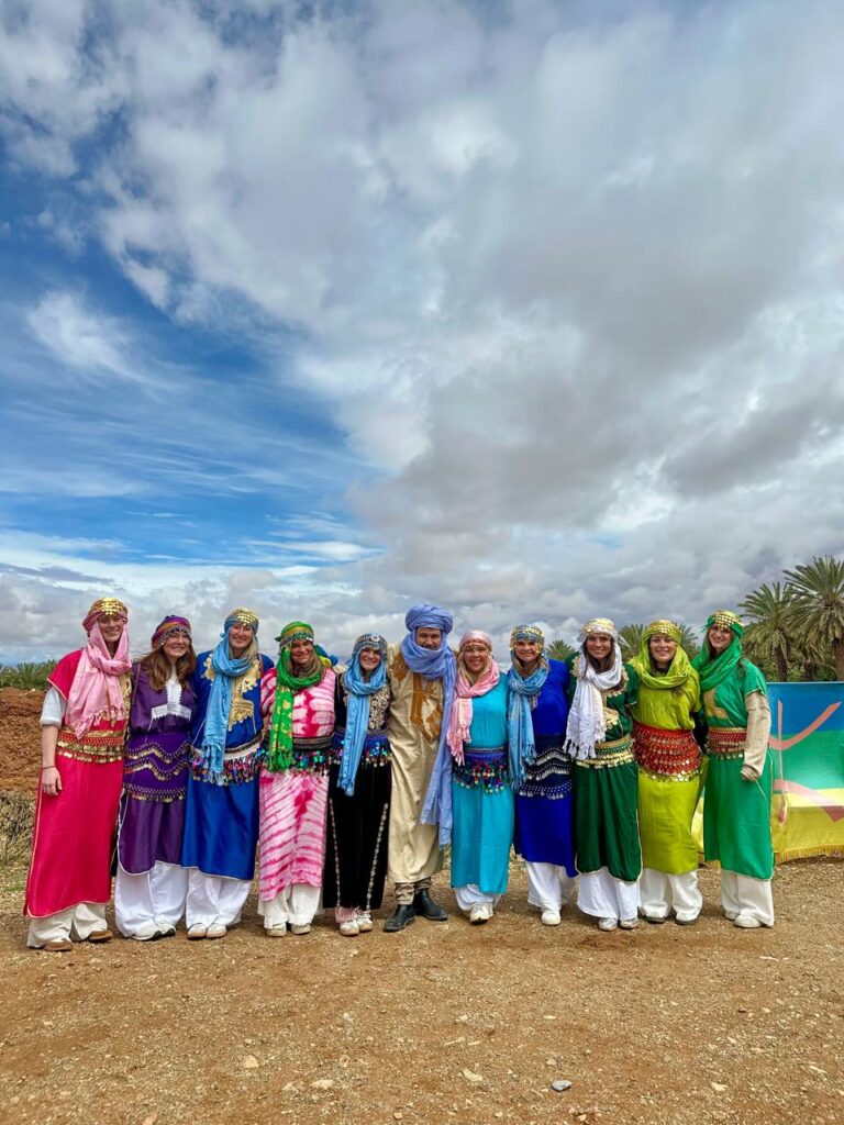 Student group in traditional Amazigh dress with their Morocco Cultours guide