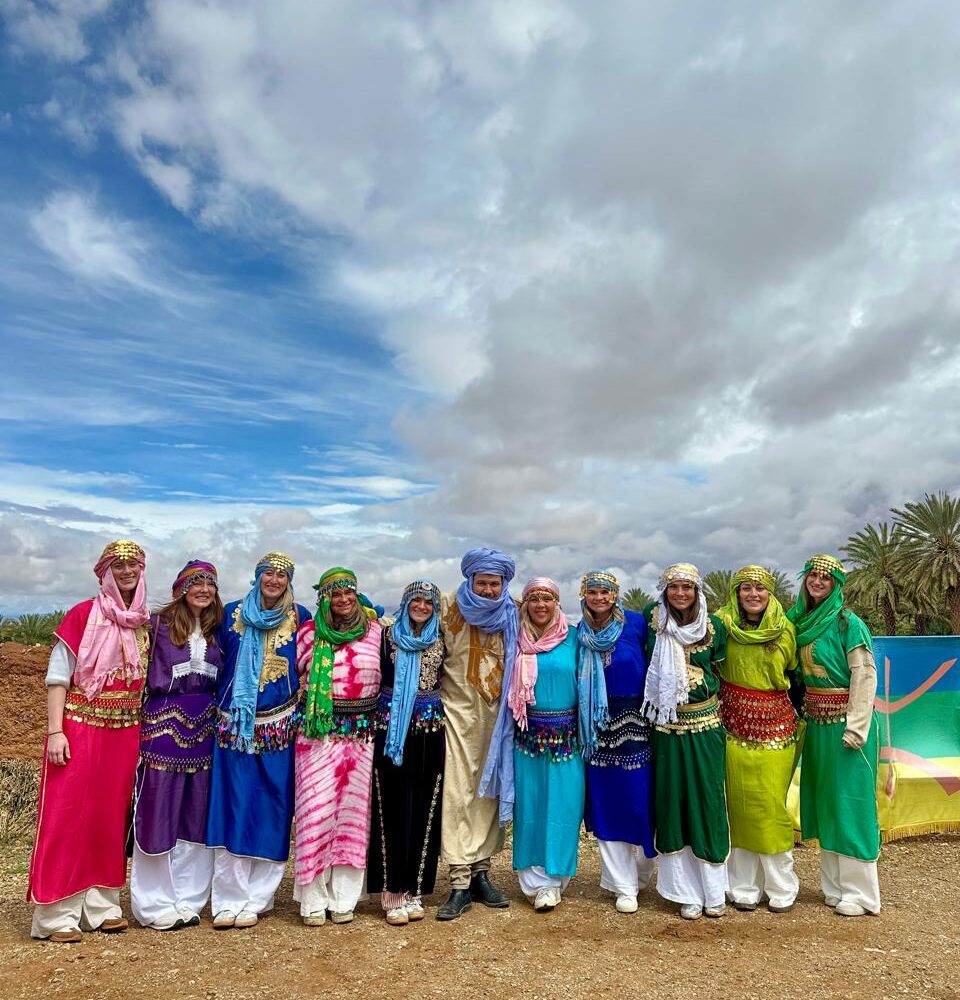 Student group in traditional Amazigh dress with their Morocco Cultours guide
