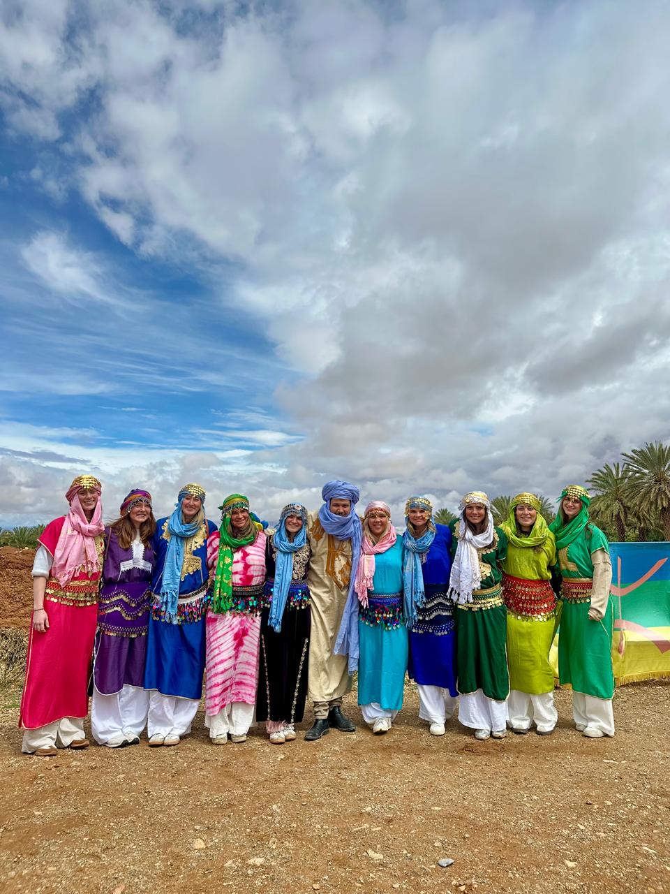 Student group in traditional Amazigh dress with their Morocco Cultours guide
