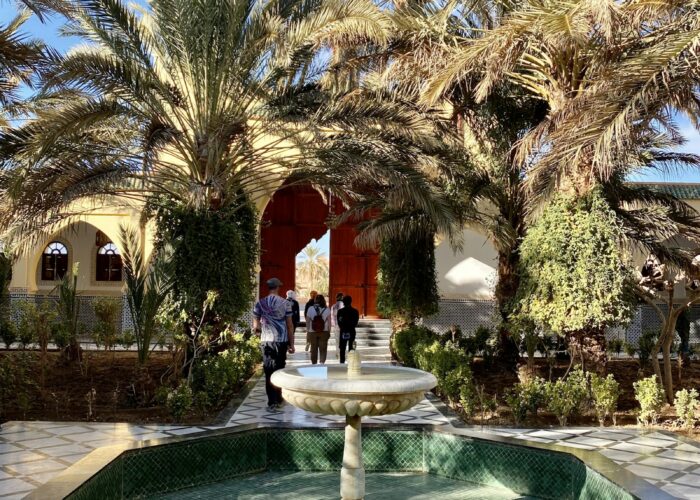 Courtyard with a fountain and palm trees in Rissani
