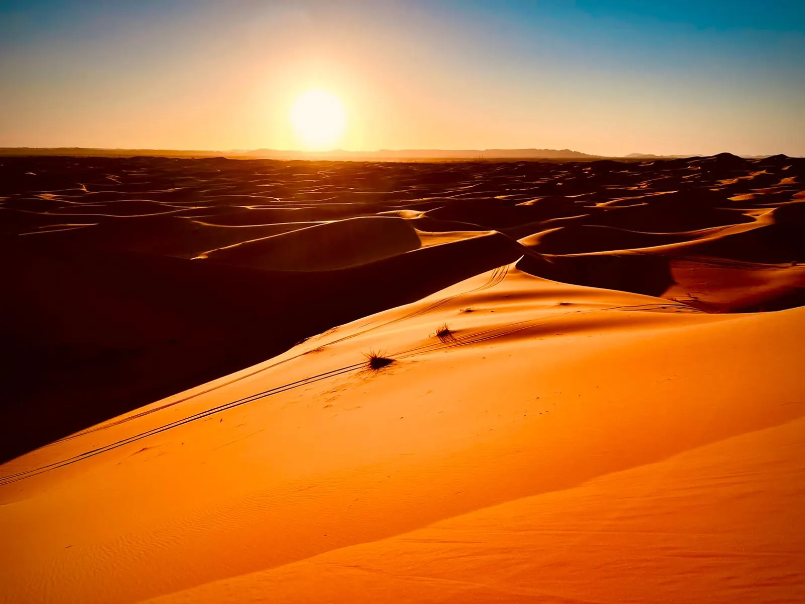 Sunset over the Sahara dunes on a Morocco Cultours desert tour